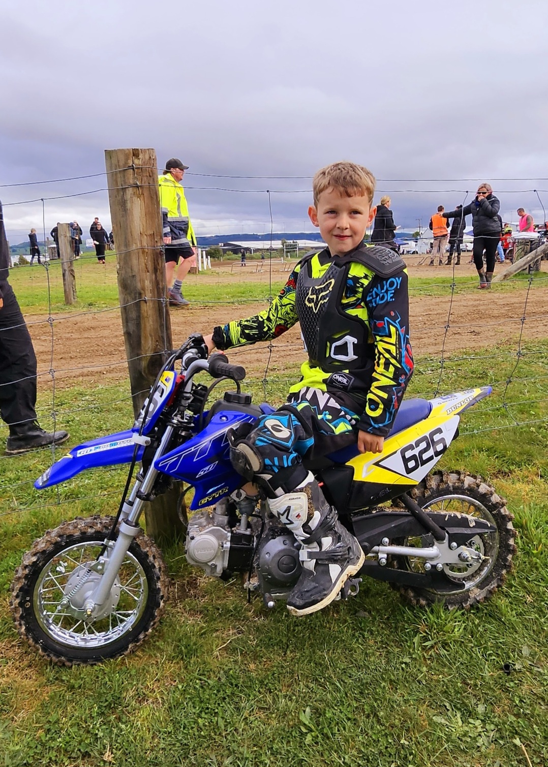 James Drought on his YZ50 motocross bike at race day, age 5