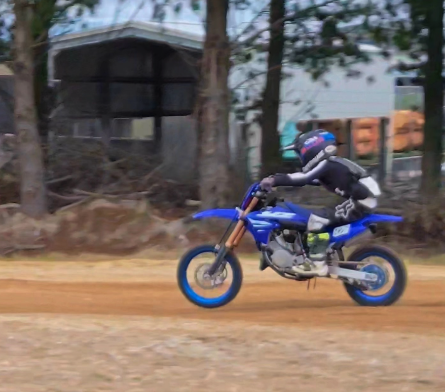 James Drought riding motocross on dirt